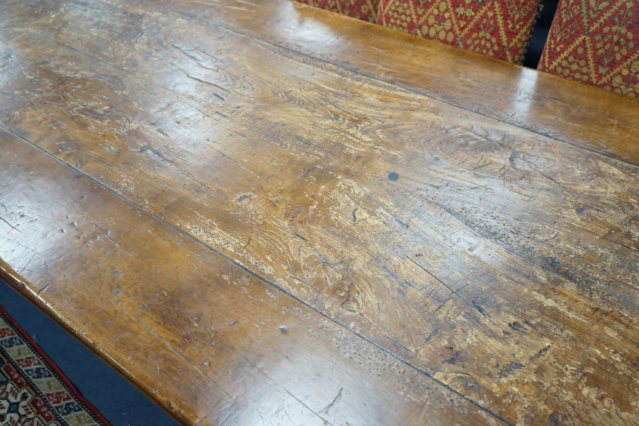 An 18th century style rectangular walnut refectory dining table on baluster end supports with central stretcher, length 270cm, width 106cm, height 76cm